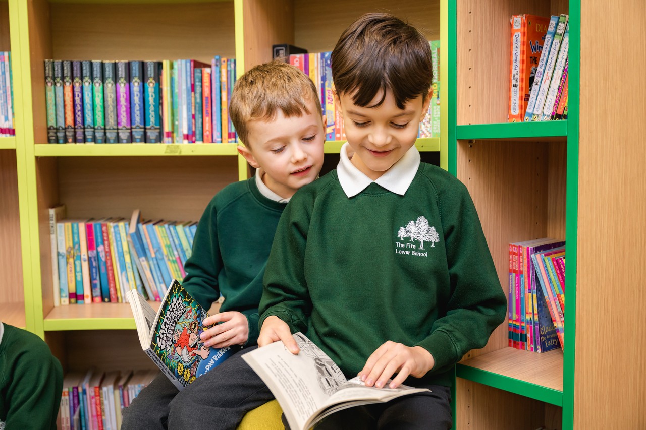 Children reading books in our library